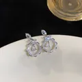 Macro detail of elegant silver-colored floral lace stud earrings with sparkling zircon stones - Silver Post Lace Waterdrop Drop Earrings / Silver