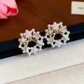 Macro shot of elegant 14k gold plated pearl wreath stud earrings with bow detail - Silver Needle - Gold - Gold Bowknot