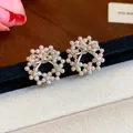 Detailed close-up of elegant bowknot pearl stud earrings with a 14k gold-plated finish - Silver Needle - Gold - Silver Bowknot