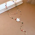 Detail of a multi-colored floral necklace with resin petals and vibrant crystal accents. - Necklace / Gold & White & Multicolor
