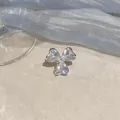 Macro detail of zircon flower ear clip featuring heart-shaped stones in silver finish - Ear Bone Clip (Single) / Silver
