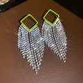 Macro view of neon green square rhinestone tassel earrings with sparkling starbursts. - 53# Silver Needle - Green
