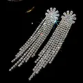Detailed macro view of luxurious silver needle tassel earrings with sparkling rhinestones - 57# Silver Earring Post - Silver