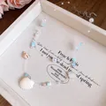 Detailed view of the ocean-themed shell and faux pearl necklace with blue accents - Blue-White