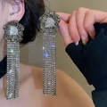 Close-up of exquisite gunmetal rhinestone tassel fringe earrings with flower design. - 63# Silver Needle - Gun Black