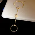 Exquisite 14k gold plated finger bracelet with zircon flower detail for a vintage look - Gold