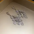 Close-up showing the brilliant sparkle of these dense crystal leaf tassel earrings. - 64# Silver Earring Post - Silver