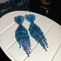 Close-up of elegant blue gradient rhinestone tassel earrings with heart-shaped tops - 24# Silver Earring Post-Gun Black-Green