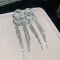 Detailed close-up view of sparkling rhinestone tassel fringe drop earrings in silver tone - 25# Silver Needle - Silver