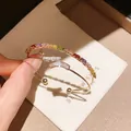18K gold-plated open bangle featuring vibrant colorful and clear zircon baguettes - Rainbow Square Zirconia Open Bangle (HB5481)