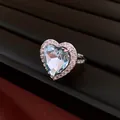 Close-up of vintage heart-shaped blue zircon ring with micro-pave setting detail - Heart Open Ring / Silver-Blue