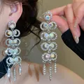 Elegant silver tassel drop earrings with shimmering iridescent rhinestones SKU detail - 72# Silver Earring Post - Silver