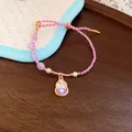 Elegant hand-braided pink rope bracelet featuring pearls and a flower gourd charm pendant - Purple Gourd Style