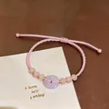 Elegant hand-woven pink rope bracelet with a light purple donut chalcedony bead accessory - Pink Adjustable Cord Style
