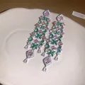 Close-up of long tassel flower earrings with pink and green stones in light luxury style - Silver Post Tassel Style (HE34195) / Pink Green (Silver Base)