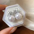 Close-up of elegant silver needle stud earrings with lustrous pearls and sparkling zircons - 1# Silver Earring Post - Silver