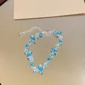 Macro shot of light blue marquise-cut crystals on an elegant silver-finish bracelet. - Oval Main Stone Style
