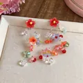 Close-up of colorful resin flower tassel earrings with vibrant dopamine style - Flower Tassel Style (HE32248) / Colorful