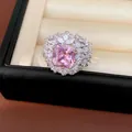 Macro detail showing the pink zircon and surrounding white stones of the royal ring - Pink Square Zirconia Open Ring / Silver-Pink