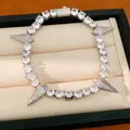 Detailed close-up of a hip-hop punk style zircon bracelet with triangular spikes - Silver-White