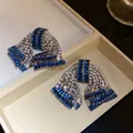 Close-up of elegant bowknot earrings with blue and white sparkling zircon stones jewelry - Silver Post Bowknot (HE32637) / Silver-Light Blue Zirconia