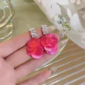 Pink shell petal earrings with clear zircon stones for a resort-style summer look. - Pink