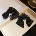 Elegant black rhinestone bow stud earrings for women featuring premium zircon inlay - Silver Post Bowknot (HE32637) / Gunmetal