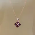 Detailed close-up of a rose gold necklace featuring a purple water-drop zircon flower pendant - Rose Gold - Purple