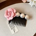Close-up detail of an elegant French style fabric rose hair comb with white pearls - Single Piece / Pink