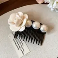 Close-up detail of a French style hair comb with fabric rose and iridescent pearls - Single Piece / White