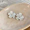 Elegant cream enamel flower stud earrings with a sparkling zirconia center and silver needle - Silver & White (Silver Earring Post)