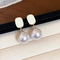 Macro detail of French style enamel square top with round lavender pearl drop earrings - Gold Style / Cream White