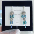 Elegant silver needle dangle earrings featuring blue geometric glass beads and tassels - Style 2 (HE23083-1) / Gold-Blue