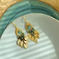 Ethnic style gold earrings with turquoise beads and gold leaf tassels on ceramic plate. - Style 3 (WE5141-1) / Gold-Blue