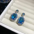 Elegant silver-tone stud earrings featuring oval blue crystals with a shimmering stone halo - 47# Silver Earring Post - Silver & Blue