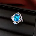 Detailed view of a vintage palace style silver ring with a large blue cubic zirconia. - Open Ring (Silver-Blue) / Blue