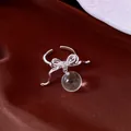 Detailed view of silver bow open ring with clear resin bead and zircon accents - Bowknot Open Ring (HR3620) / Silver