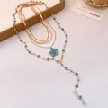 Luxury multi-layered gold metal necklace featuring blue flower pendant and blue gemstones - Set of Multi-piece (Sky Blue) / Gold