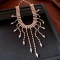 Luxurious rhinestone water-drop tassel necklace detail with sparkling crystals - Gold