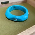 Macro view of blue resin bangle featuring an elegant gemstone and rhinestone inlay - Sky Blue
