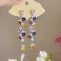 Close-up of colorful heart-shaped zircon tassel earrings shown on a display card - Silver Needle-Silver-Colorful
