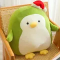 Adorable green Christmas penguin plush toy wearing a red Santa hat on a wooden chair - Green / 50cm 0.8kg