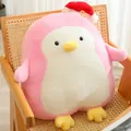 Cuddly pink penguin plush toy wearing a red Christmas hat sitting on a wooden chair - Pink / 50cm 0.8kg