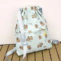 Light green canvas drawstring backpack with cute cartoon capybara print for casual use - Light Blue