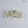 Elegant pearl-encrusted bow-shaped hair claw clip in a creamy white glossy finish - Double Layer Hollow Geometric Style(11#) / Approx. 8cm