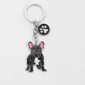 Detailed view of the French Bulldog zinc alloy keychain with a paw print charm - Black French Bulldog with Paw Print Tag