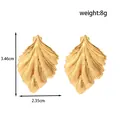 Elegant golden leaf-shaped irregular stainless steel earrings for women, 3.46cm - Leaf Design / Gold