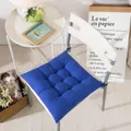 Square thick tufted blue chair cushion with ties for dining or office chairs in lifestyle setting - 40cm X 40cm / Sapphire Blue