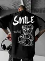 T-shirt nera oversize da uomo con stampa grafica dell'orso del sorriso gotico bianco - S / Nero
