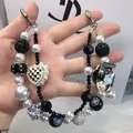 Elegant black and white handmade beaded phone strap with pearls and heart charm - Camellia Number 5 Brand Style (A5-N)